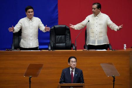Japan's Prime Minister Fumio Kishida (bottom) delivers a speech in the presence of Philippine Senate President Juan Miguel Zubiri (left) and Philippine House Speaker Martin Romualdez at the House of Representative in Quezon City on November 4, 2023. (AFP)