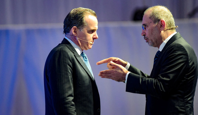 Jordanian Deputy Prime Minister and Foreign Minister Ayman Safadi (R) and US National Security Council Coordinator for the Middle East and North Africa Brett McGurk, engage in a conversation during the IISS Manama Dialogue security conference, in Manama on November 18, 2023. (AFP)