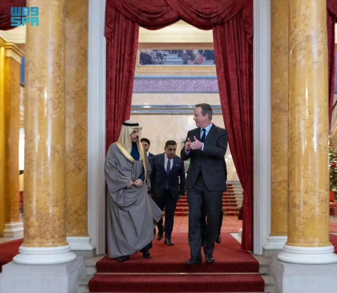 Saudi Foreign Minister Prince Faisal bin Farhan meets with British Foreign Secretary David Cameron in London. (SPA)