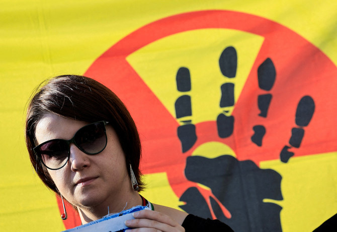 Above, an activist attends a protest at the UN Climate Change Conference in Dubai on Dec. 8, 2023. (Reuters)