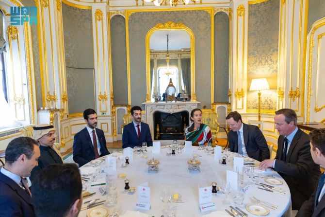 Saudi Foreign Minister Prince Faisal bin Farhan meets with British Foreign Secretary David Cameron in London. (SPA)