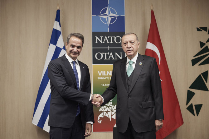 Greece’s Prime Minister Kyriakos Mitsotakis, left, shakes hands with Turkiye’s President Recep Tayyip Erdogan on July 12, 2023 during their meeting at the NATO Summit in Vilnius, Lithuania. (Greek Prime Minister’s Office via AP)