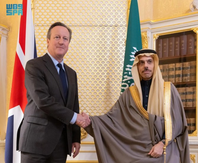 Saudi Foreign Minister Prince Faisal bin Farhan meets with British Foreign Secretary David Cameron in London. (SPA)