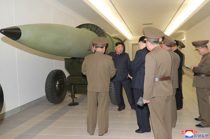Kim Jong Un, second left, inspects a nuclear weaponization project at an unknown location in North Korea. (KCNA via KNS/AFP)