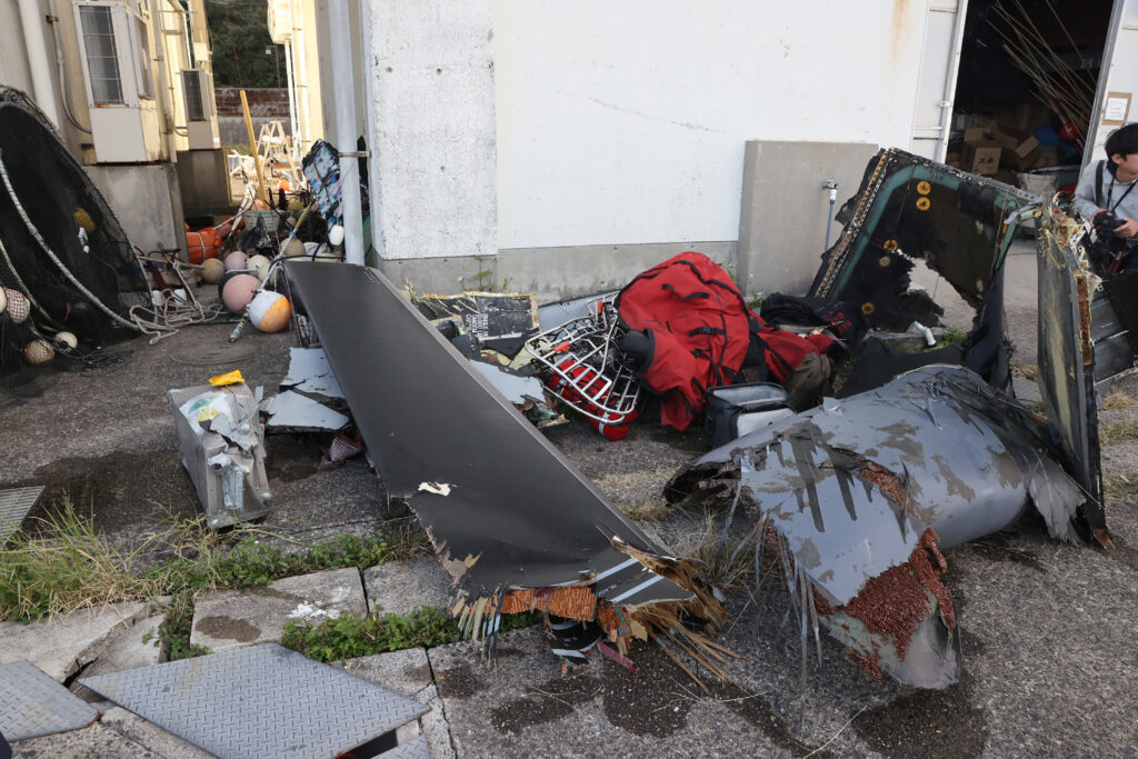 Recovered debris, believed to be part of wreckage from a crashed US Air Force CV-22B Osprey tilt-rotor aircraft, is seen after it was brought ashore at Yakushima-cho in Kagoshima prefecture on Nov.30 (AFP)