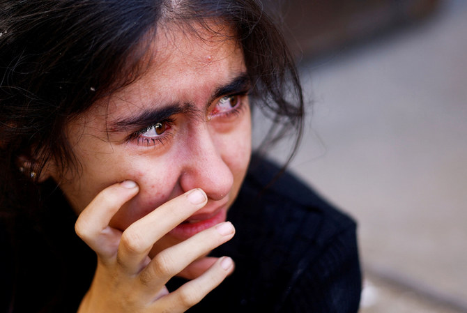 A Palestinian girl reacts at the site of an Israeli strike on a house, after a temporary truce between Hamas and Israel expired, in Khan Younis in the southern Gaza Strip, December 1, 2023. (REUTERS)