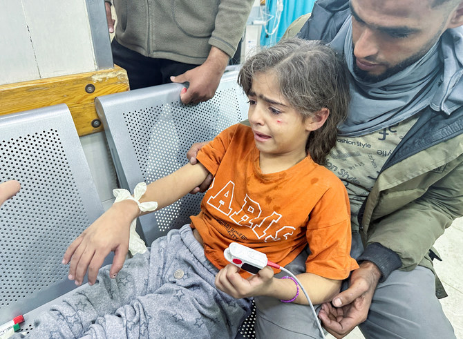 A Palestinian girl wounded in an Israeli strike on a house receives medical attention, after a temporary truce between Hamas and Israel expired, at Nasser hospital in Khan Younis in the southern Gaza Strip, December 1, 2023. (REUTERS)