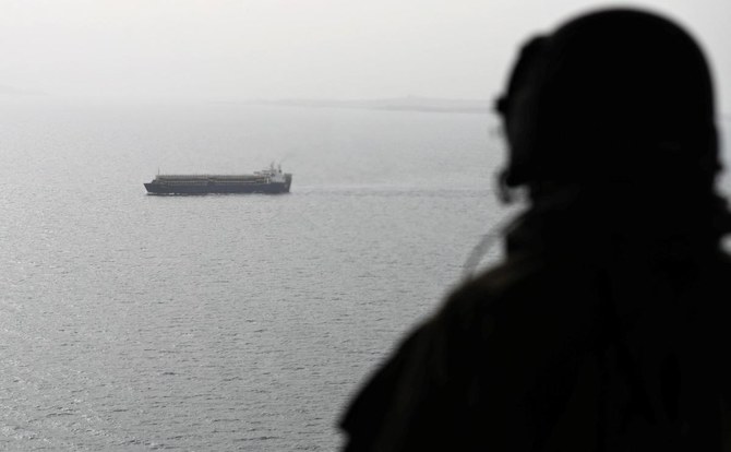 A picture taken on August 10, 2018 from a military plane shows a ship crossing through the strategic strait of Bab al-Mandab, which separates the Arabian Peninsula from east Africa. (AFP)