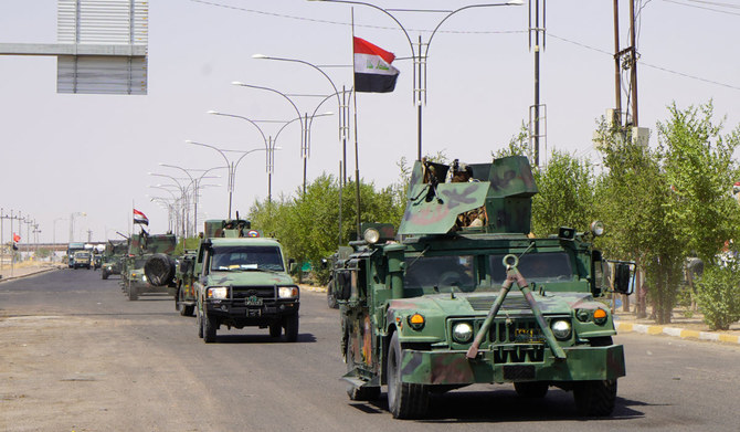 Humvee vehicles of the Iraqi security forces move along a road in Iraq's multi-ethnic northern city of Kirkuk on September 5, 2023. (AFP)