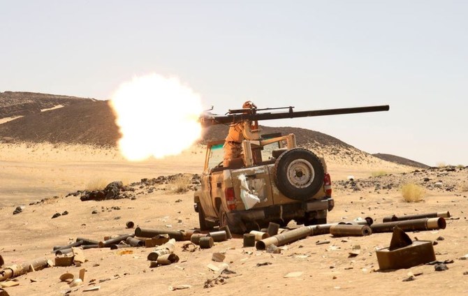 A Yemeni government fighter fires a vehicle-mounted weapon at Houthi positions in Marib, Yemen, Mar. 9, 2021. (Reuters)