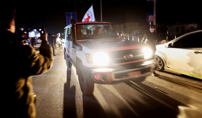 A Red Cross vehicle, as part of a convoy carrying hostages abducted by Hamas militants during the October 7 attack on Israel, arrives at the Rafah border, amid a hostages-prisoners swap deal between Hamas and Israel, in the southern Gaza Strip, November 30, 2023. (REUTERS)