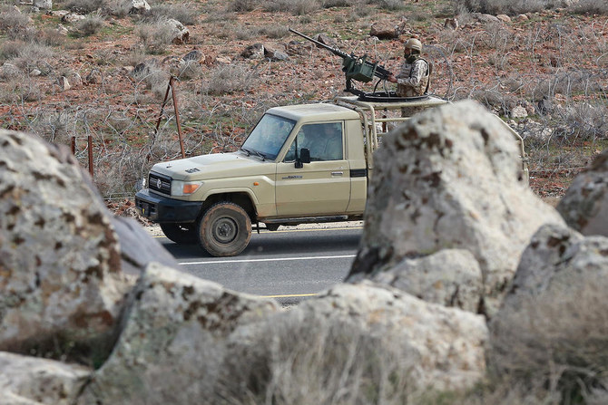 Above, Jordanian army soldiers patrol along the border with Syria to prevent trafficking on Feb. 17, 2022. Drug trafficking from Syria into Jordan is becoming ‘organized,’ according to the army. (AFP)