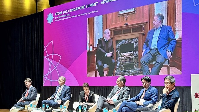 Moderna co-founder Noubar Afeyan, screen right, speaks to Advanced Tomorrow (ATOM) chairman Armen Sarkissian during the ATOM 2023 Singapore Summit at the National University of Singapore on Dec. 4, 2023. (NUS)