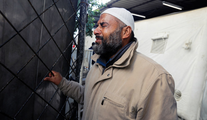 A man reacts, as people mourn Palestinians killed in Israeli strikes on houses, at Abu Yousef al-Najjar hospital in Rafah in the southern Gaza Strip, December 7, 2023. (REUTERS)