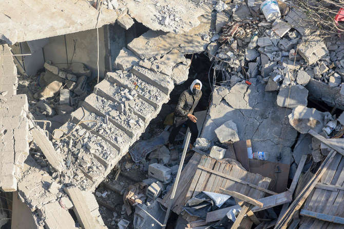 A man walks among the rubble of a building destroyed destroyed Israeli bombardment overnight in Rafah on the southern Gaza Strip on December 7, 2023, amid continuing battles between Israel and the Palestinian militant group Hamas. (AFP)