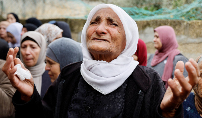 A woman reacts during the funeral of Omar Abu Baker, 16, in the West Bank. The boy was killed in an Israeli raid, near Jenin. (Reuters)