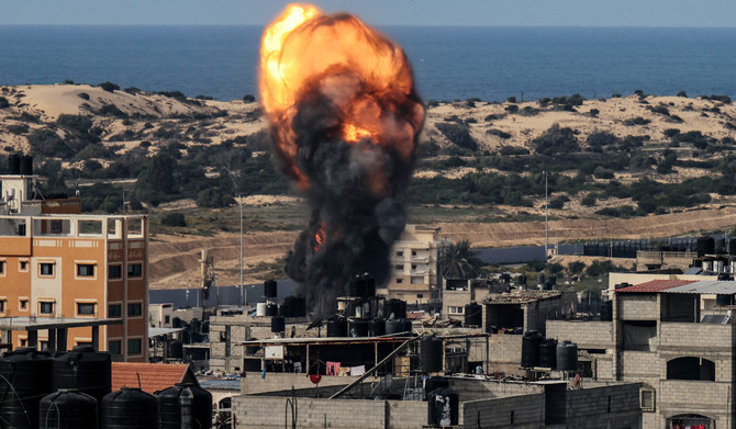 A ball of fire rises above a building during an Israeli strike, in Rafah in the southern Gaza Strip on December 9, 2023, amid continuing battles between Israel and the militant group Hamas. (AFP)