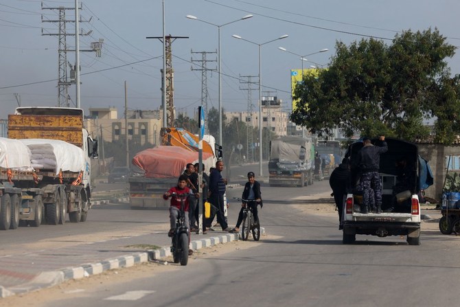 Trucks carrying humanitarian aid are seen near the Rafah border crossing with Egypt in the southern Gaza Strip on Dec. 10, 2023. (AFP)