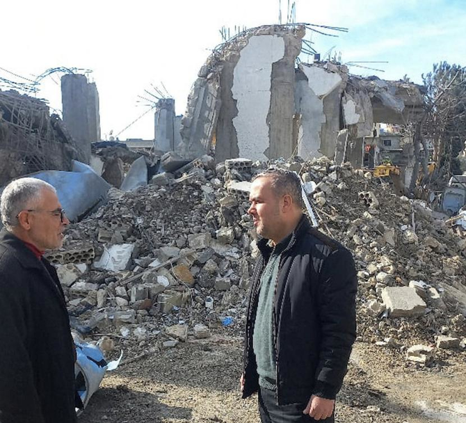 Hezbollah lawmaker Hassan Fadlallah stands near the rubble of a destroyed building in Aita Al-Shaab, in the aftermath of cross-border hostilities between Hezbollah and Israeli forces in southern Lebanon. (Reuters)