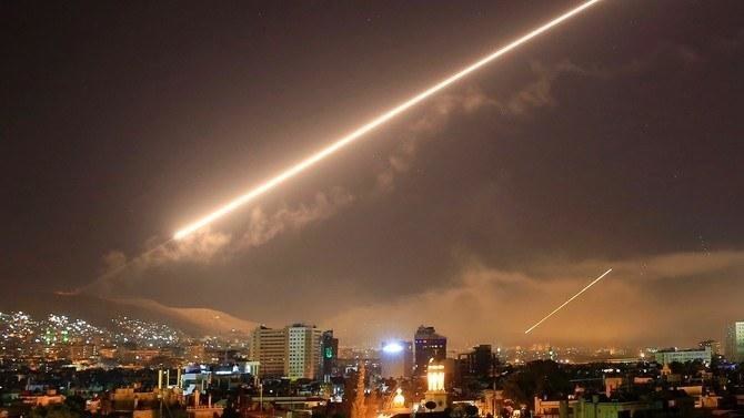 Syria’s air defenses intercept missiles in Masyaf, northwestern Syria. (File/AP)