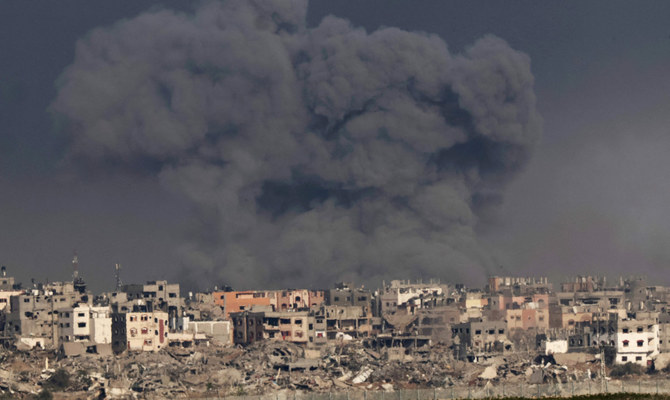 A picture taken from southern Israel near the border with the Gaza Strip on December 12, 2023, shows smoke billowing during Israeli bombardment of the Palestinian territory amid ongoing battles with the Hamas militant group. (AFP)