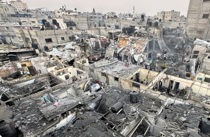 People search through the rubble of damaged buildings following an Israeli air strike on Palestinian houses, amid the ongoing conflict between Israel and the Palestinian Islamist group Hamas, in Rafah in the southern Gaza Strip December 12, 2023. (REUTERS)