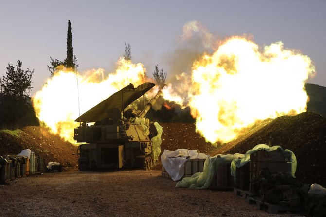 An Israeli artillery unit fires from a position in Upper Galilee in northern Israel towards southern Lebanon on December 11, 2023, amid increasing cross-border tensions with Hezbollah militants. (AFP)