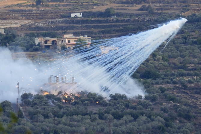 A shell from Israeli artillery explodes over a house in Al-Bustan, a Lebanese border village with Israel on Oct. 15, 2023. (AP)