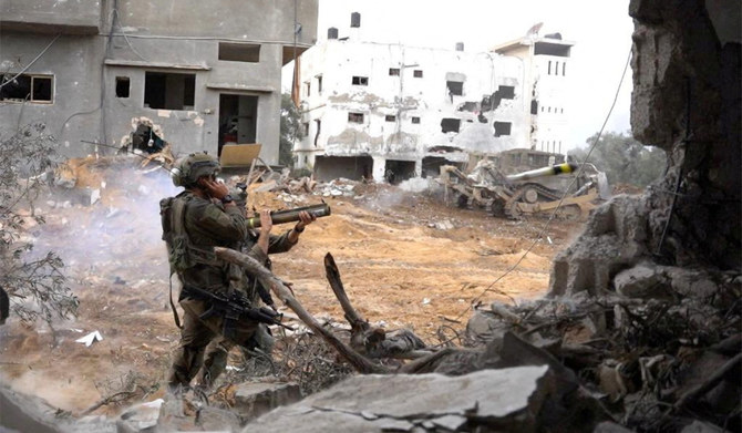 Israeli soldiers operate in the Gaza Strip amid the ongoing conflict between Israel and the Palestinian Islamist group Hamas, in this handout picture released on December 14, 2023. (REUTERS)