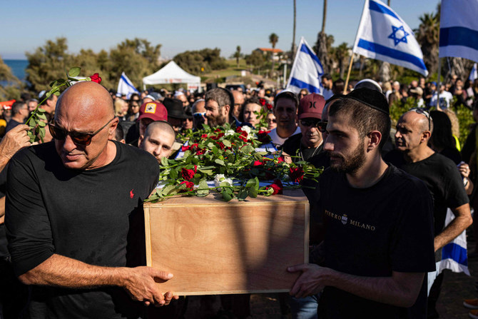 Family and friends mourn during the funeral of Eden Zachariya, who was abducted from the Tribe of Nova music festival on October 7, in Kibbutz Palmachim, on December 15, 2023, after Israeli army recovered her body during an operation in Gaza. (AFP)