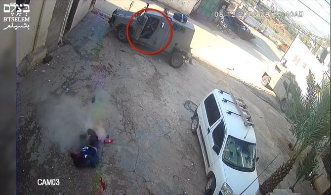 This screen grab from a video posted by the Israeli human rights group B'Tselem on X shows an Israeli soldier shooting at a Palestinian man already incapacitated by gunfire during a military raid in a West Bank refugee camp on Dec. 8, 2023. (X: @btselem)