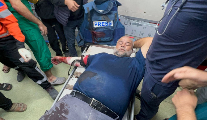 Veteran Al-Jazeera correspondent Wael Al-Dahdouh receives medical care after we was injured while covering ongoing battles between Israel and the Palestinian Hamas group in Gaza, at Nasser hospital in Khan Yunis in the southern Gaza Strip on December 15, 2023. (AFP)