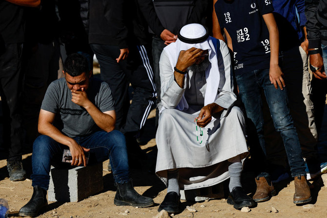 Mourners react during the funeral of Samer Fouad Al-Talalka, a member of Israel's Bedouin Arab minority who was mistakenly killed by the Israeli military while being held hostage in Gaza by the Palestinian Islamist group Hamas, in Hura village, southern Israel, December 16, 2023. (Reuters)