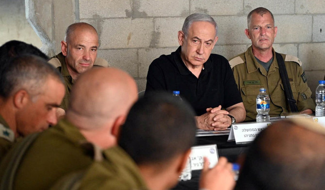 Israeli Prime Minister Benjamin Netanyahu meets with soldiers as he visits an Israeli army base in Tze'elim, Israel November 7, 2023. (REUTERS)