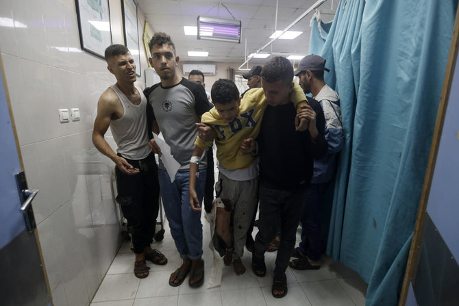 Palestinians wounded in Israeli airstrikes on a UN-run school arrive at the Nasser hospital in the town of Khan Younis, southern Gaza Strip on Sunday, Dec. 17, 2023. (AP)