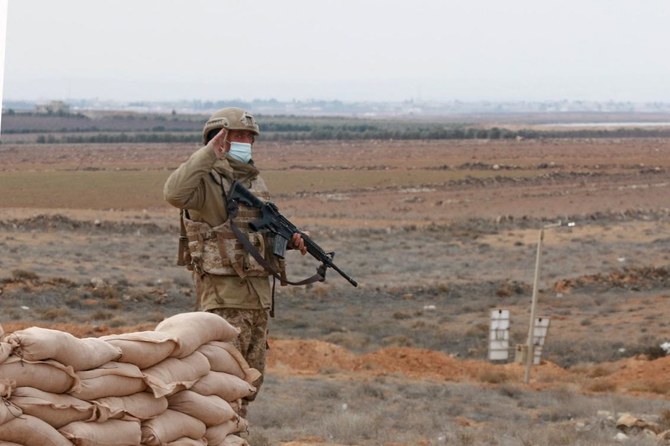 A picture taken during a tour origanized by the Jordanian Army shows soldiers patrolling along the border with Syria to prevent trafficking, on February 17, 2022. (AFP)