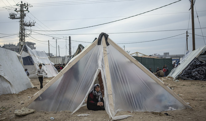 Palestinians displaced by the Israeli ground offensive on the Gaza Strip set up a tent camp in the Muwasi area. (AP)