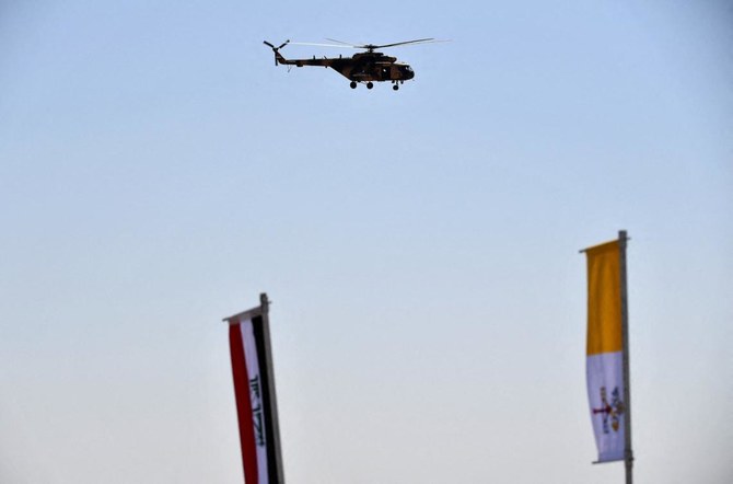 An Iraqi army helicopter hovers above the House of Abraham in the ancient city of Ur in southern Iraq's Dhi Qar province, on March 6, 2021. (AFP)