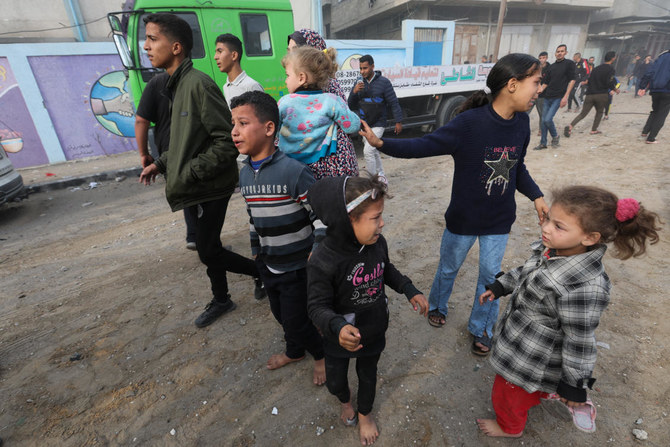Palestinian children react at the site of an Israeli strike on a house, amid the ongoing conflict between Israel and Hamas, in Rafah, in the southern Gaza Strip, on Dec. 20, 2023. (Reuters)