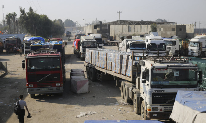 Humanitarian aid trucks enter through the Kerem Shalom crossing from Israel into the Gaza Strip on Monday, Dec. 18, 2023. (AP)