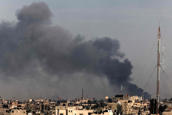 A picture taken from Rafah shows smoke billowing following Israeli bombardment in Khan Yunis in the southern Gaza Strip on December 20, 2023. (AFP)