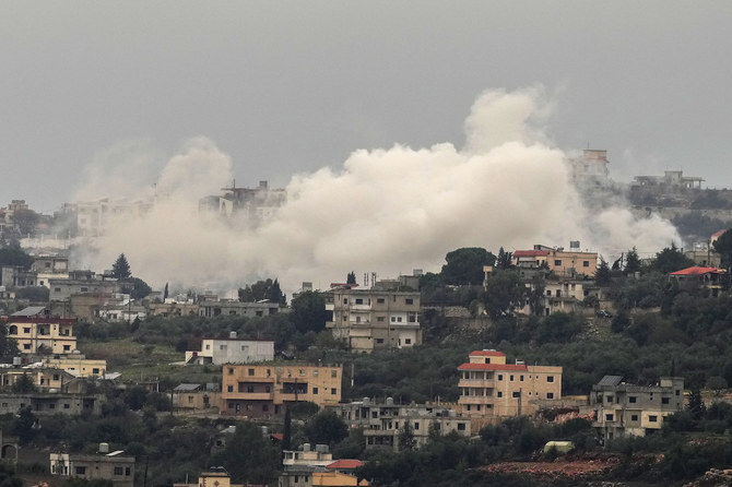 Smoke rises from Israeli artillery shelling on Aita al-Shaab, a Lebanese border village with Israel, in south Lebanon, Saturday, Dec. 9, 2023. (AP Photo/Hassan Ammar)