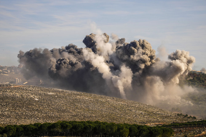 Black smoke rises from an Israeli airstrike on the outskirts of Yaroun, a Lebanese border village with Israel, in south Lebanon, Sunday, Dec. 10, 2023. (AP Photo/Hassan Ammar)