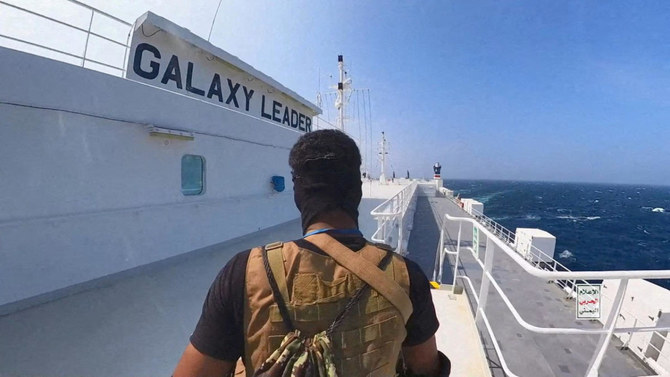 A Houthi fighter stands on the Galaxy Leader cargo ship in the Red Sea in this photo released November 20, 2023. (File/Reuters)