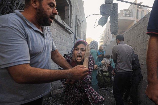 People flee following Israeli air strikes on a neighbourhood in the Al-Maghazi refugee camp in the central Gaza Strip. (File/AFP)
