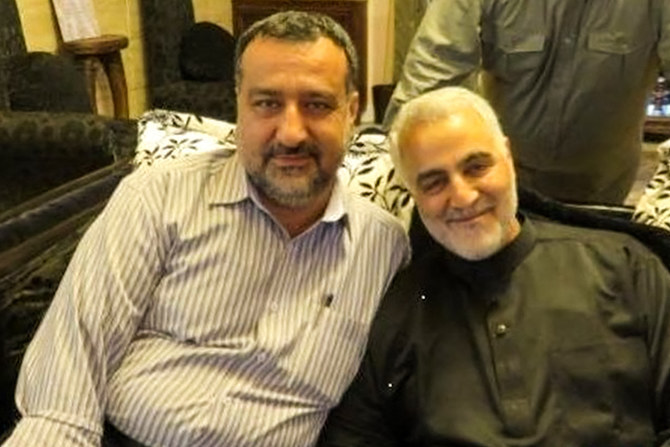 Razi Moussavi (L), a senior adviser for Iran's Islamic Revolutionary Guard Corps, sits in an undisclosed location alongside the slain commander of the IRGC's Quds Force Qasem Soleimani. (File/AFP)
