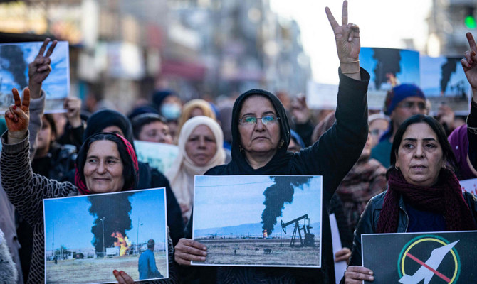 Demonstrators stage a rally in Qamishli in northeastern Syria against Turkish military strikes in the area. (AFP)