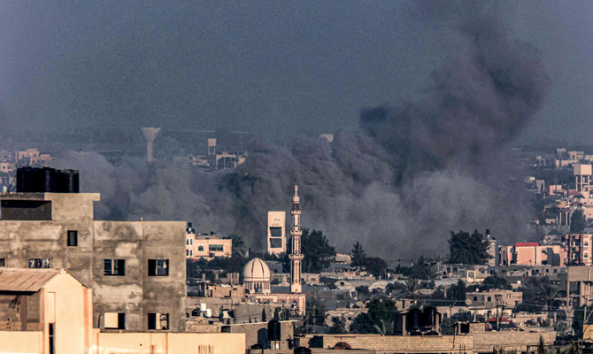 Smoke billows over Khan Yunis during Israeli bombardment from Rafah in the southern Gaza Strip on December 25, 2023, amid the ongoing conflict between Israel and the Palestinian militant group Hamas. (AFP)