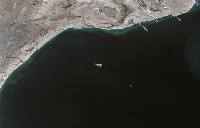 This handout satellite picture released by Maxar Technologies on November 28, 2023, shows the recently seized Isreali-linked Galaxy Leader ship (C), that was captured by Huthi fighters on November 19, next to a support vessel in the southern Red Sea near Hodeida, Yemen. (File/AFP)