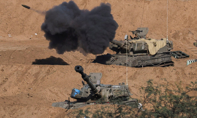 An Israeli self-propelled artillery unit fires amid the ongoing conflict between Israel and the Palestinian Islamist group Hamas, as seen from southern Israel, December 26, 2023. (Reuters)